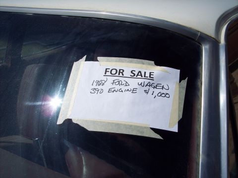 1981 Kenworth W900A - A handwritten sign advertises a 1968 Ford station wagon with a 390 engine for sale at $1,000.