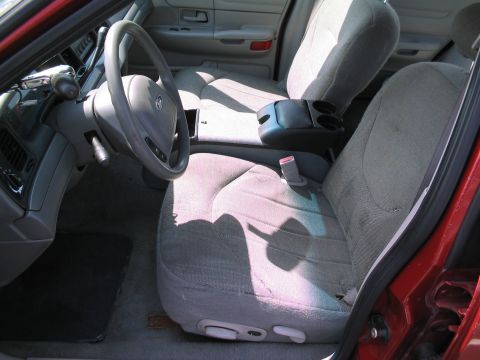 2001 Ford Crown Victoria - Interior view of a 2001 Ford Crown Victoria, highlighting the front seating area and dashboard.