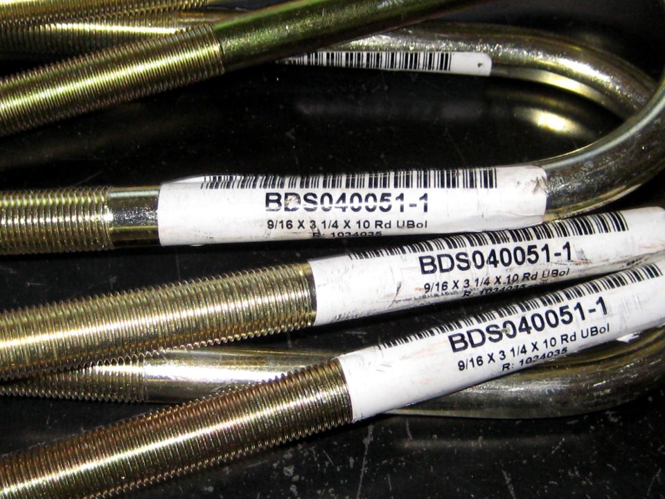 Several U-bolts with labels showing part number BDS040051-1 and dimensions 9/16 x 3 1/4 x 10 Rd UBol