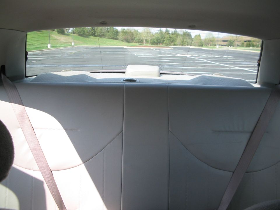 Interior rear seat and seatbelts with view through rear window