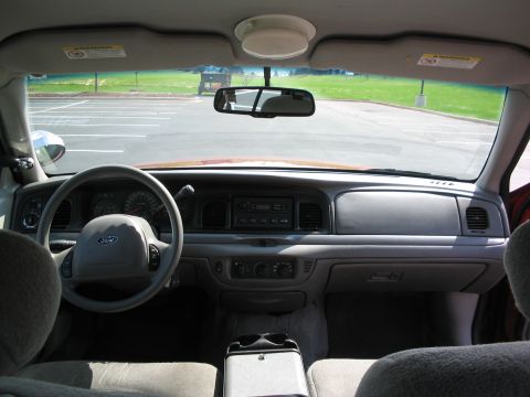 2001 Ford Crown Victoria - Interior view of a 2001 Ford Crown Victoria, highlighting the dashboard and driver's area.