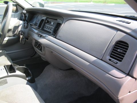2001 Ford Crown Victoria - Interior view of a 2001 Ford Crown Victoria dashboard, including the steering wheel and center console.