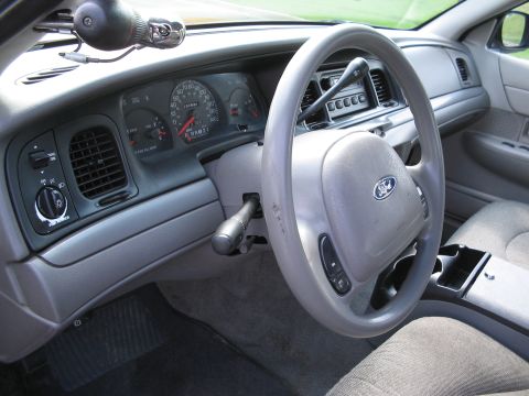 2001 Ford Crown Victoria - The interior of a 2001 Ford Crown Victoria, the dashboard, steering wheel, and instrument cluster.
