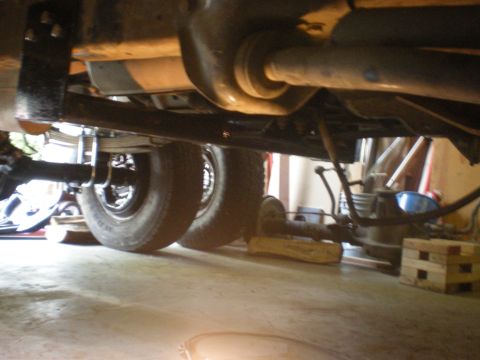 1993 Ford Bronco - Undercarriage view shows the rear axle and dual wheels of a vehicle.