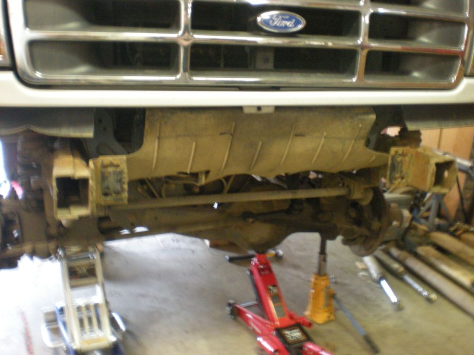 1993 Ford Bronco front grille and suspension lifted on jacks
