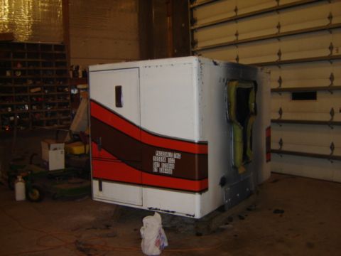1992 Ford Bronco - A white truck sleeper cab with a distinctive red and brown stripe design is shown, with exposed insulation visible on one side.