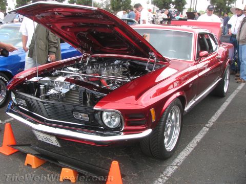 1968 Ford Mustang - Customized 1969 Ford Mustang at a car show, displaying its engine.