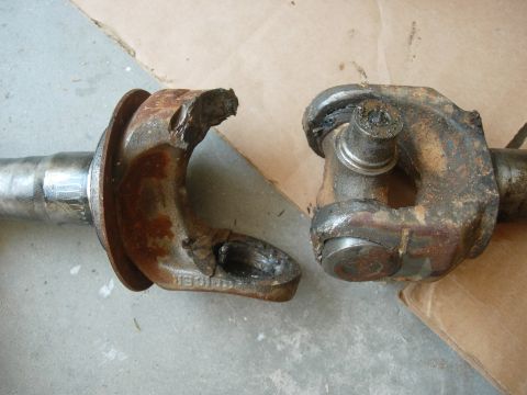 1995 Ford Bronco - A severely damaged driveshaft u-joint, showing a broken yoke and cross, indicating a catastrophic failure.