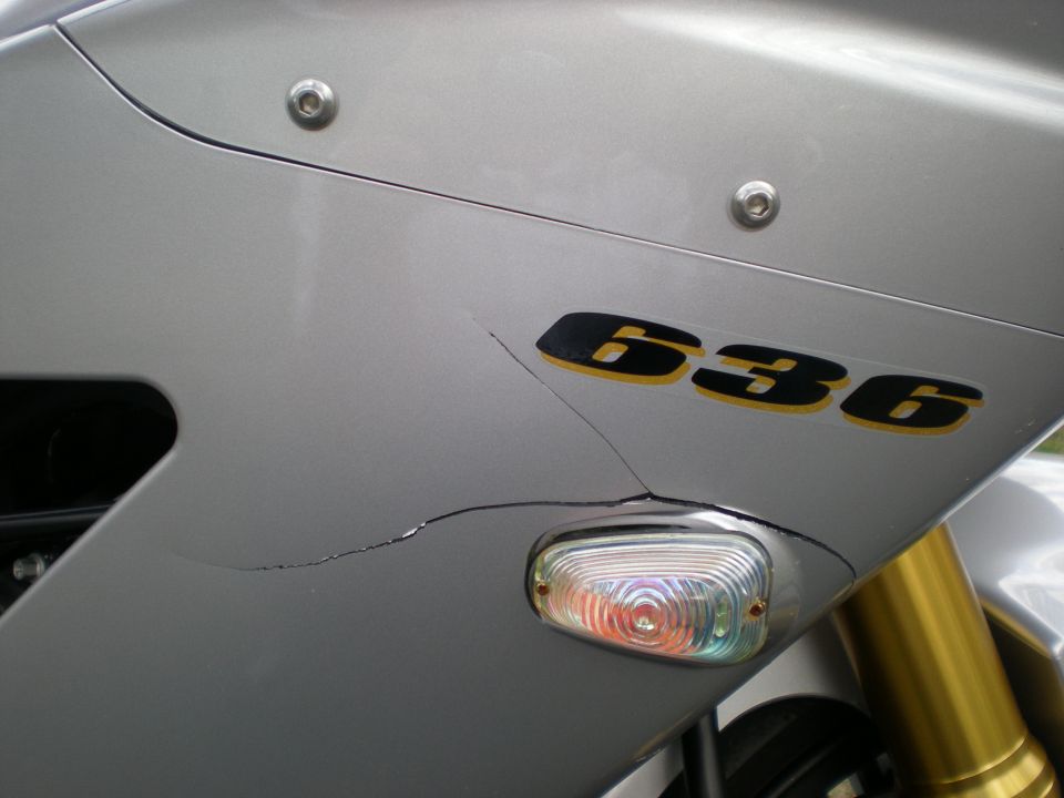 Cracked silver motorcycle fairing with 636 decal and clear flush turn signal