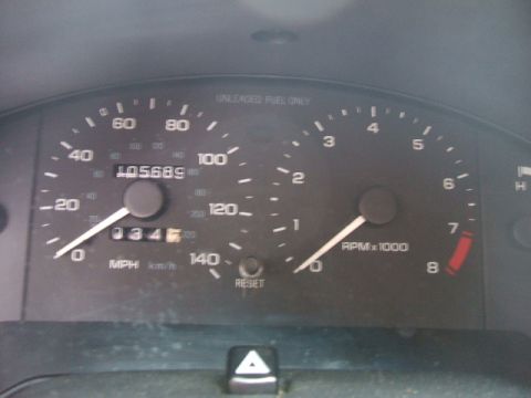 1997 Ford Probe - Vehicle's dashboard gauges, including speedometer and tachometer, are visible.