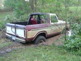1979 Ford Bronco - This 1978 Ford Bronco is stuck deep in the mud, with only its rear visible.