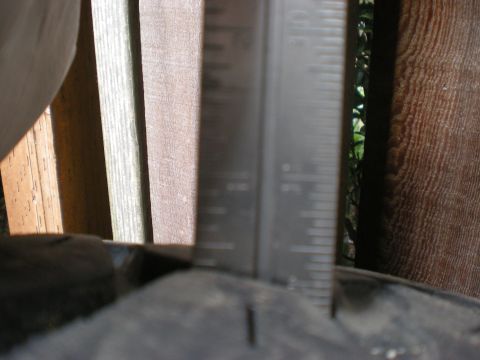 1993 Ford Bronco - Measuring tire tread depth with a ruler-style gauge.