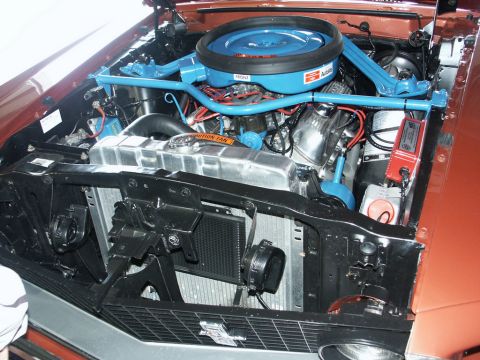 2001 Mercury Grand Marquis - The engine bay is visible with an orange exterior and blue engine components.
