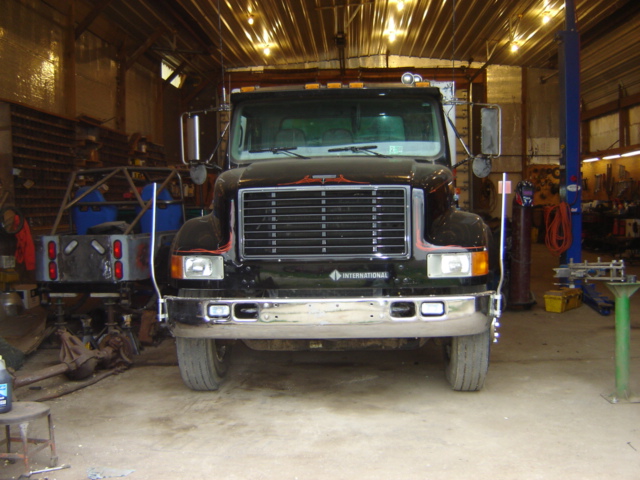 Front view of black International truck with chrome grille and bumper