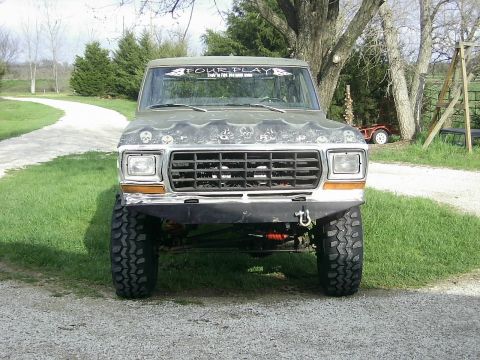 1978 Ford Bronco - Front view of a lifted 1978 Ford Bronco, modified with large tires and a custom bumper.