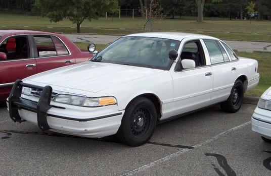 White 1996 Ford Crown Victoria police car, 3/4 front view with push bumper