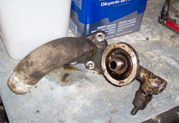 dirty oil cooler adapter with hoses and mounting holes