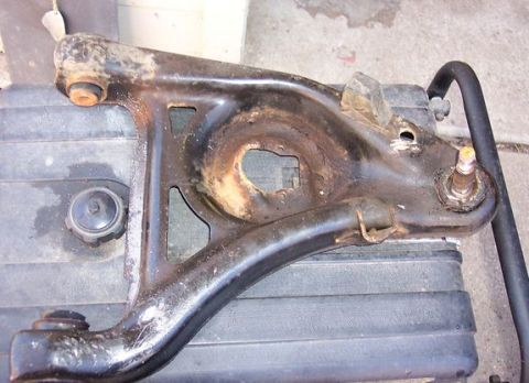 1996 Ford Crown Victoria - This is a used suspension control arm, likely for a car's front end.