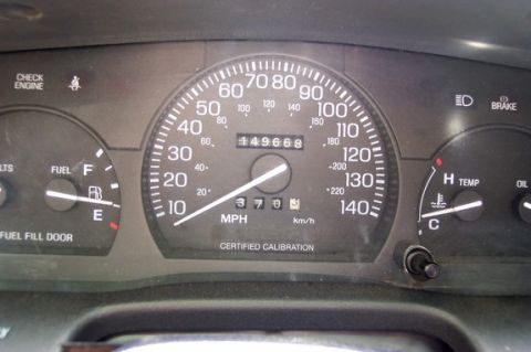 1996 Ford Crown Victoria - The dashboard displays the odometer reading of 49,668 miles, alongside the speedometer and other essential gauges.