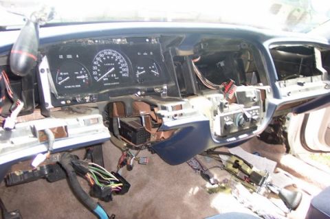 1996 Ford Crown Victoria - The dashboard of a 1996 Ford Crown Victoria is shown with its interior disassembled and wiring exposed.