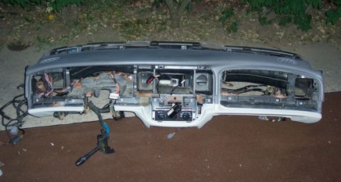 1996 Ford Crown Victoria - The dashboard assembly is shown removed from the vehicle, exposing its internal wiring and mounting points.