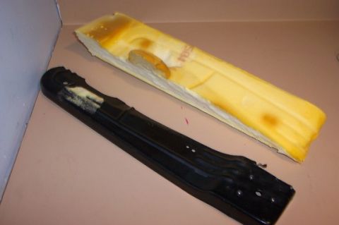 1996 Ford Crown Victoria - Disassembled car seat components, including foam padding and a metal frame, are shown.