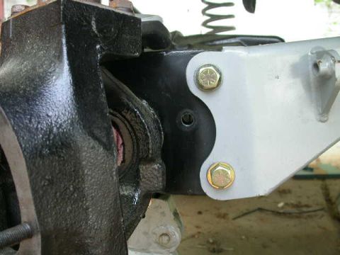 1990 Ford Bronco - Hole drilled in radius arm mount for through frame brake fitting.