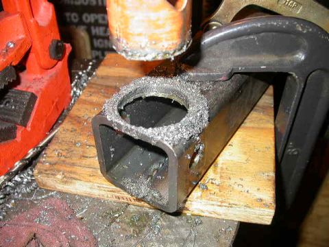 1990 Ford Bronco - Sawed out a 1.75" hole to allow the heim room to pivot.