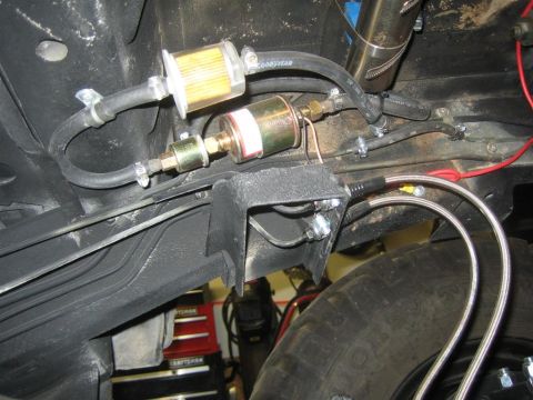 1987 Suzuki Samurai - Underside view of dual fuel filters and associated lines, likely part of a vehicle's fuel system.