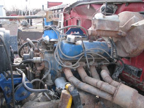 1980 Ford F-250 - Close-up view of a vehicle's engine bay, showing various mechanical components and wiring.