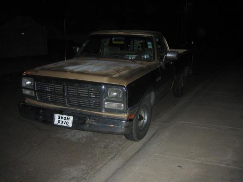 1999 Ford F-250 - This Dodge Ram pickup truck is parked outside at night, showing its front and side profile.