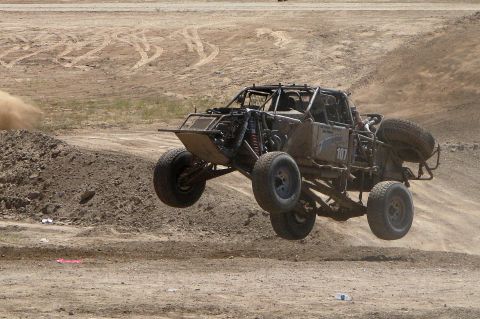 2008 Ford Bronco - This off-road buggy is captured mid-air during a race, with the number 107 clearly visible on its side.