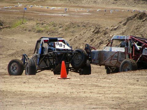 2008 Ford Bronco - Two off-road buggies are on a dirt track, one with the number 981 visible.