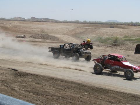 2008 Ford Bronco - Off-road vehicles compete on a dusty track, with a truck and two buggies in motion.