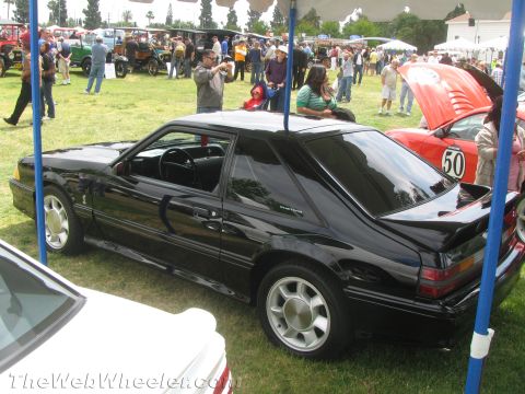 1968 Ford Mustang - A black 1987 Ford Mustang coupe is displayed at an outdoor car show.