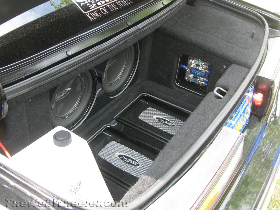 Car trunk with two subwoofers and two amplifiers installed