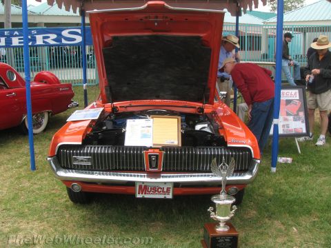 1968 Ford Mustang - Photograph of a Mercury Cougar at a car show, not a technical document.