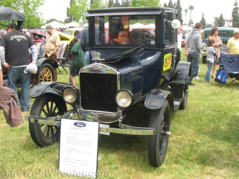 1968 Ford Mustang - Photograph of a vintage Ford Model T at a car show, not a technical document.