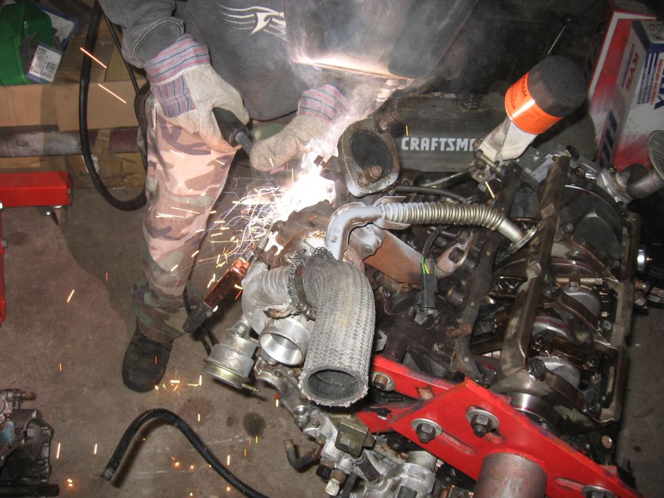my friend welding up a cracked weld on the turbo manifold