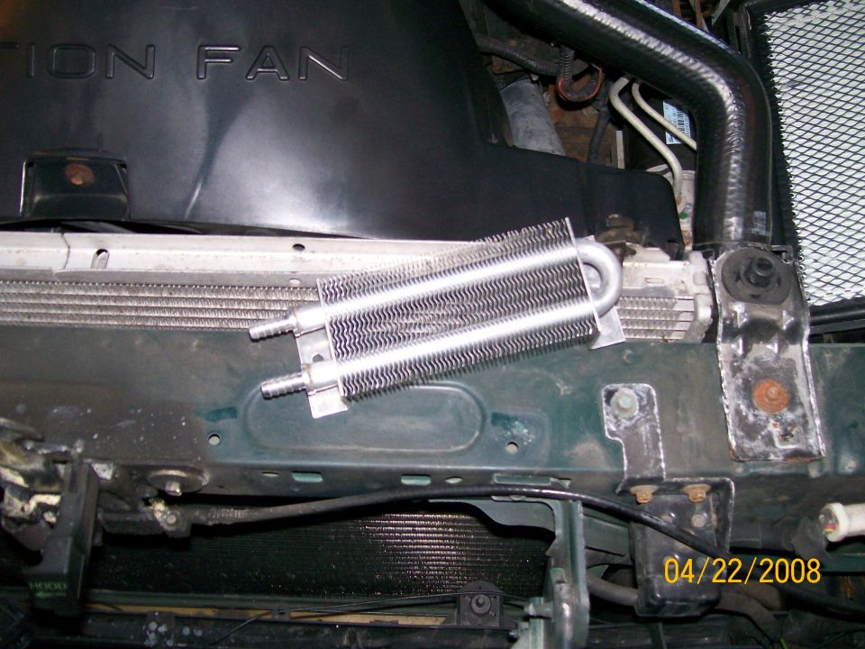 Transmission cooler mounted in front of a car radiator.