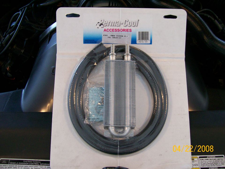 Perma-Cool power steering oil cooler kit in packaging, with hoses and cooler visible.
