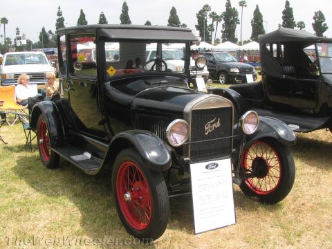 1968 Ford Mustang - Photograph of a vintage Ford Model T at a car show, not a technical document.