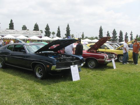 1968 Ford Mustang - Photograph of vintage Ford Torino muscle cars at a car show, not a technical document.