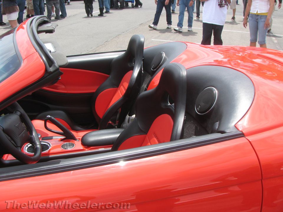 Red roadster interior with red and black seats