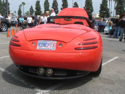 1968 Ford Mustang - Photograph of the rear of a red custom Mustang concept roadster at a car show.