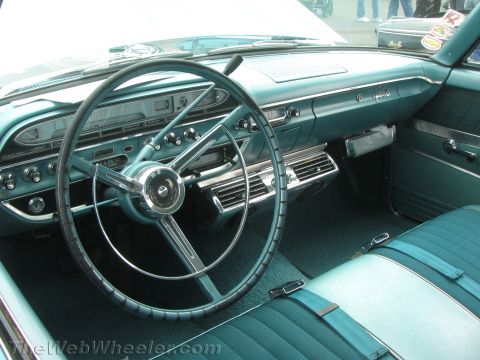 1968 Ford Mustang - Photograph of a teal classic Ford Galaxie interior showing dashboard and steering wheel.