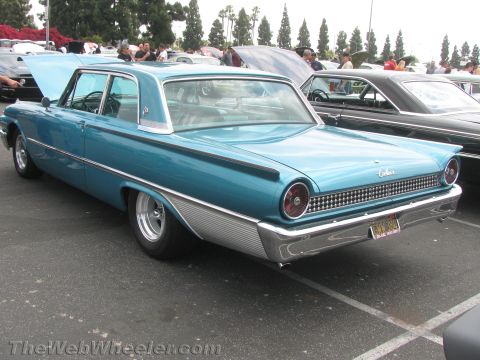 1968 Ford Mustang - Photograph of a teal early-1960s Ford Galaxie hardtop parked at a car show.