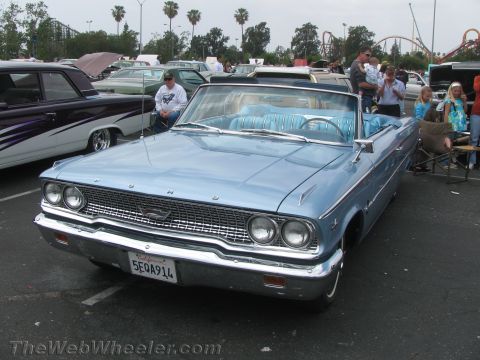 1968 Ford Mustang - Photograph of a light blue 1963 Ford Galaxie convertible at an outdoor car show.