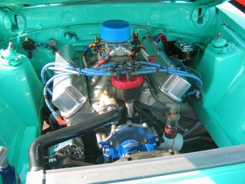 1992 Ford Mustang - Custom V8 engine bay features a prominent carburetor and blue accents.