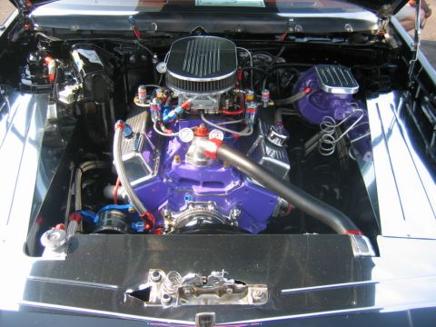 1992 Ford Mustang - A highly modified V8 engine is displayed with custom purple paint and polished components.